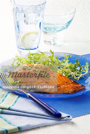 Marinated Salmon with Greens on a Blue Plate