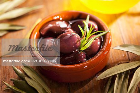 Preserved olives in an earthenware bowl Preserved olives in an earthenware bowl