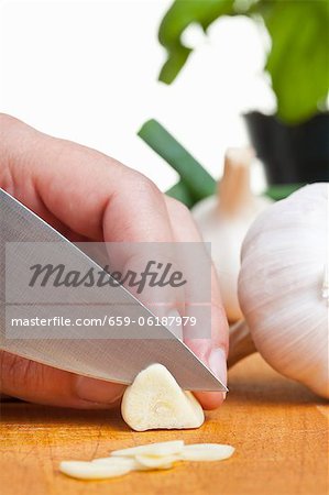 Garlic being sliced