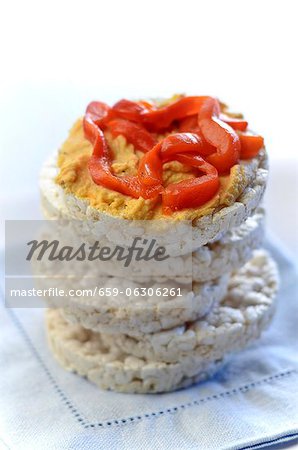 Stack of Rice Cakes with Top Cap Topped with Hummus and Roasted Red Peppers