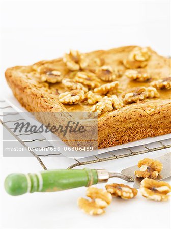 Blonde Brownies Topped with Walnuts on a Cooling Rack