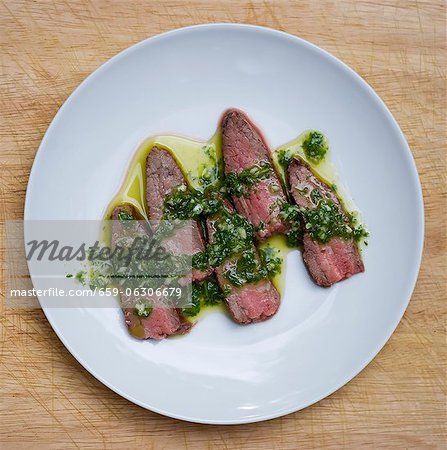 Sliced Steak Topped with Chimichurri Sauce