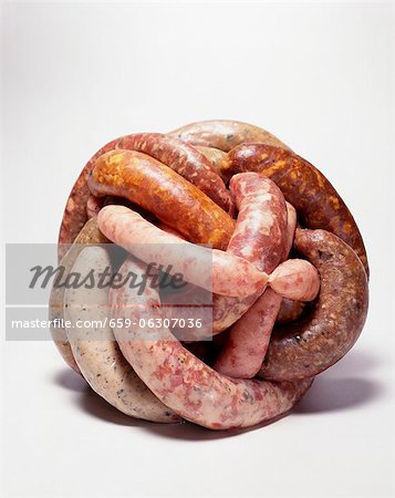 Variety of Sausages in a Ball; White Background