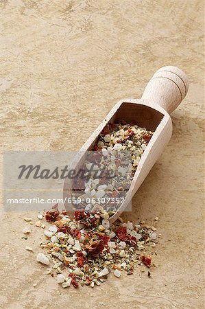Mediterranean spiced mixture in a wooden scoop Mediterranean spiced mixture in a wooden scoop