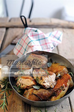 Fried guinea fowl with rosemary and sage