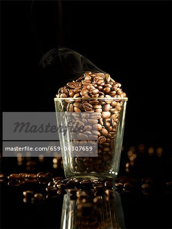 A glass of roasted coffee beans