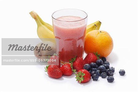 A banana, strawberry, blueberry, kiwi and grapefruit smoothie