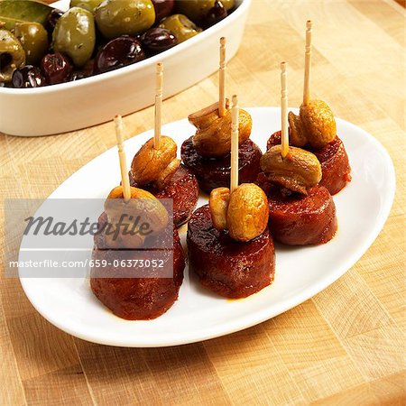 Small Dish of Chorizo and Mushroom Appetizers with Toothpicks