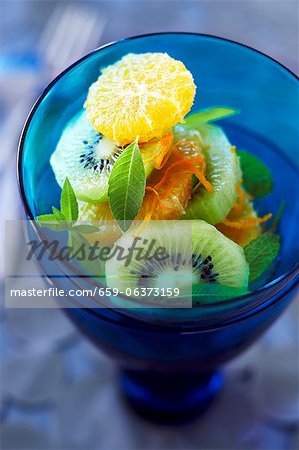 Fresh Kiwi, Orange and Mint Salad in a Blue Glass