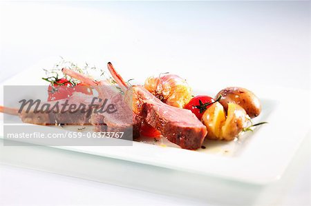 Lamb chops with roast potatoes and cherry tomatoes