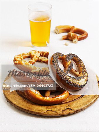 Various lye bread pretzels and a glass of beer