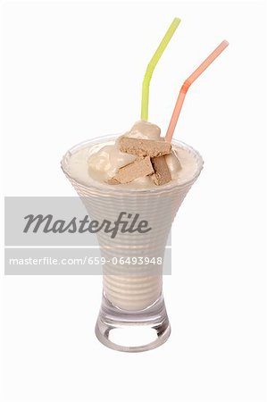 An ice cream shake with straws