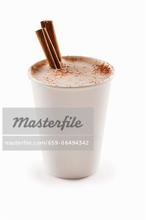 Cinnamon Cappuccino in a Paper Cup with Cinnamon Sticks; White Background
