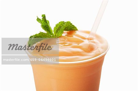 https://image1.masterfile.com/getImage/659-06494601em-mango-shake-in-a-plastic-cup-with-a-straw-white-background-stock.jpg