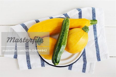 Various types of courgette (yellow, green and round)