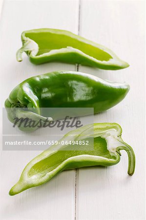 Green pointed peppers, whole and halved