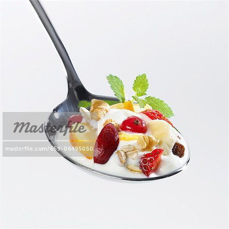 A spoonful of yoghurt muesli with fruit