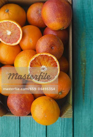 Blood oranges in a wooden crate