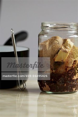 A jar of ingredients for vegan chocolate