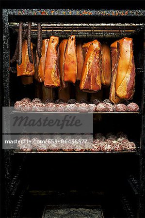 Bacon and Saumaisen (dumplings made of finely chopped salted meat) in a smoking chamber