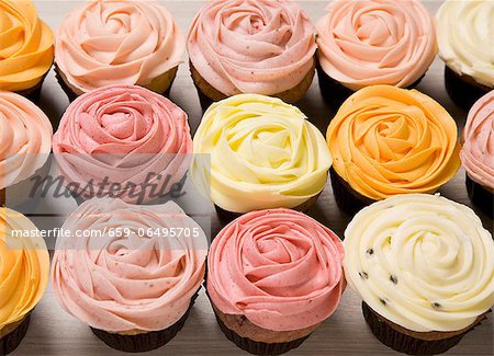 Various coloured rose cupcakes