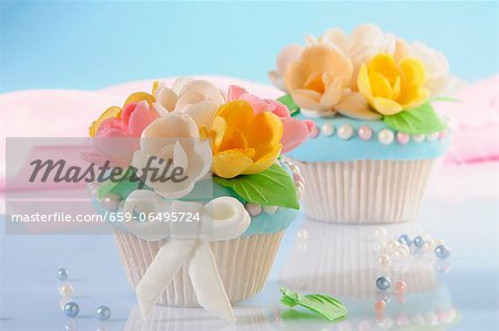 Cupcakes decorated with marzipan flowers
