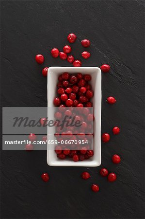 Lingonberries in a dish and on a slate platter