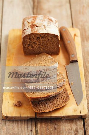 Wholemeal bread, sliced on a chopping board