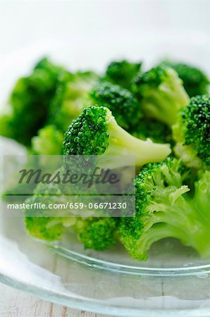 Broccoli florets on a glass plate