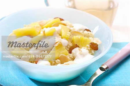Sweet couscous with pineapple, raisins and sliced almonds