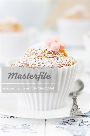 Muffins baked in silicon teacups on a Dutch tablecloth