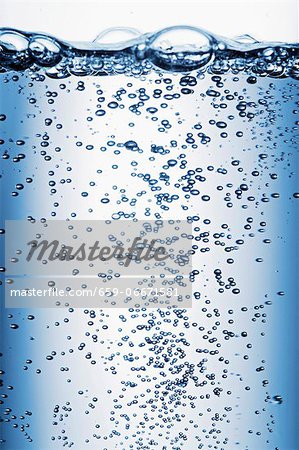 Air bubbles rising through water (close-up) Air bubbles rising through water (close-up)