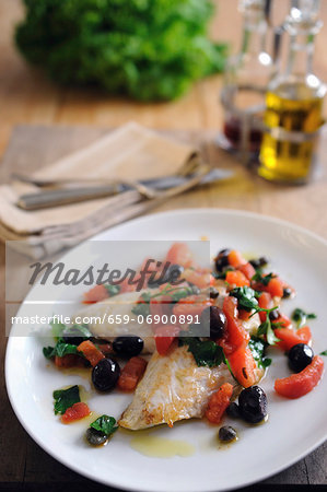 Pan fried fillets of John Dory with baby plum tomatoes and black olives and capers