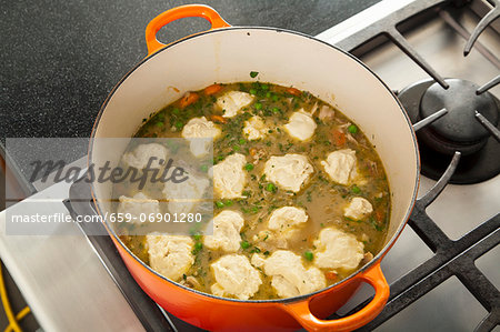 Dumplings Cooking in a Pot of Chicken Stew; From Above