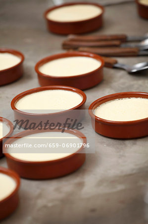 Crema catalana being prepared in individual dishes