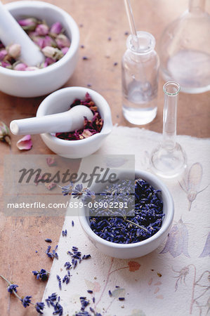 Rose and lavender flowers with mortar and apothecary bottles