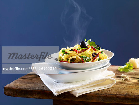 Spaghetti with dried tomatoes, olives and basil Spaghetti with dried tomatoes, olives and basil