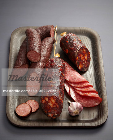 Assorted sausages and salamis on a tray