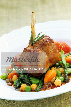 Saddle of lamb on a bed of vegetables
