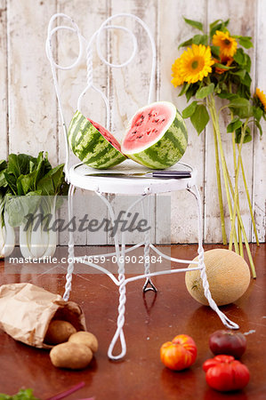 Organic Fruit and Vegetables; Halved Watermelon on a Chair