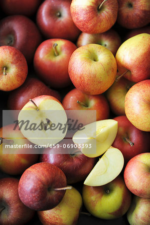 Lots of apples, whole, halved and wedges Lots of apples, whole, halved and wedges