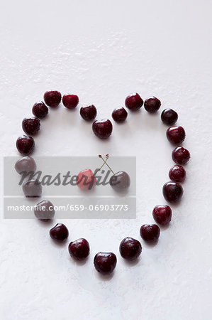 A heart made of sweet cherries