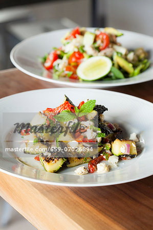 Mediterranean Zucchini Salad with Red Peppers, Red Onion and Feta Cheese; Crab Salad in Background Mediterranean Zucchini Salad with Red Peppers, Red Onion and Feta Cheese; Crab Salad in Background