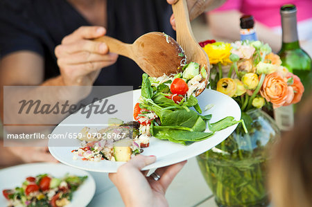 Crab Salad and Zucchini Salad Being Served with Wooden Utesnils