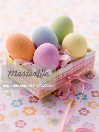 An Easter parcel with brightly coloured eggs for Easter