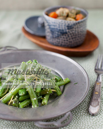 Green Bean Salad with a Bowl of Curried Turkey Stew in the Background Green Bean Salad with a Bowl of Curried Turkey Stew in the Background