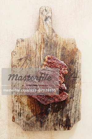 Raw spiced beef on a chopping board