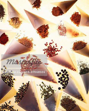 Assorted spices in baking parchment cones Assorted spices in baking parchment cones