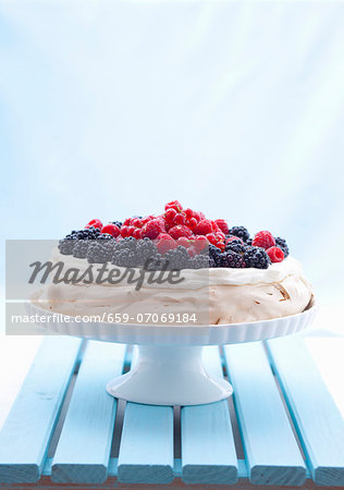 Berry pavlova on a cake stand