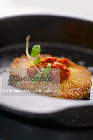 Breaded pork chop with tomato sauce and oregano Breaded pork chop with tomato sauce and oregano